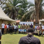 A group picture of participants at a community engagement event in Kampala, Uganda