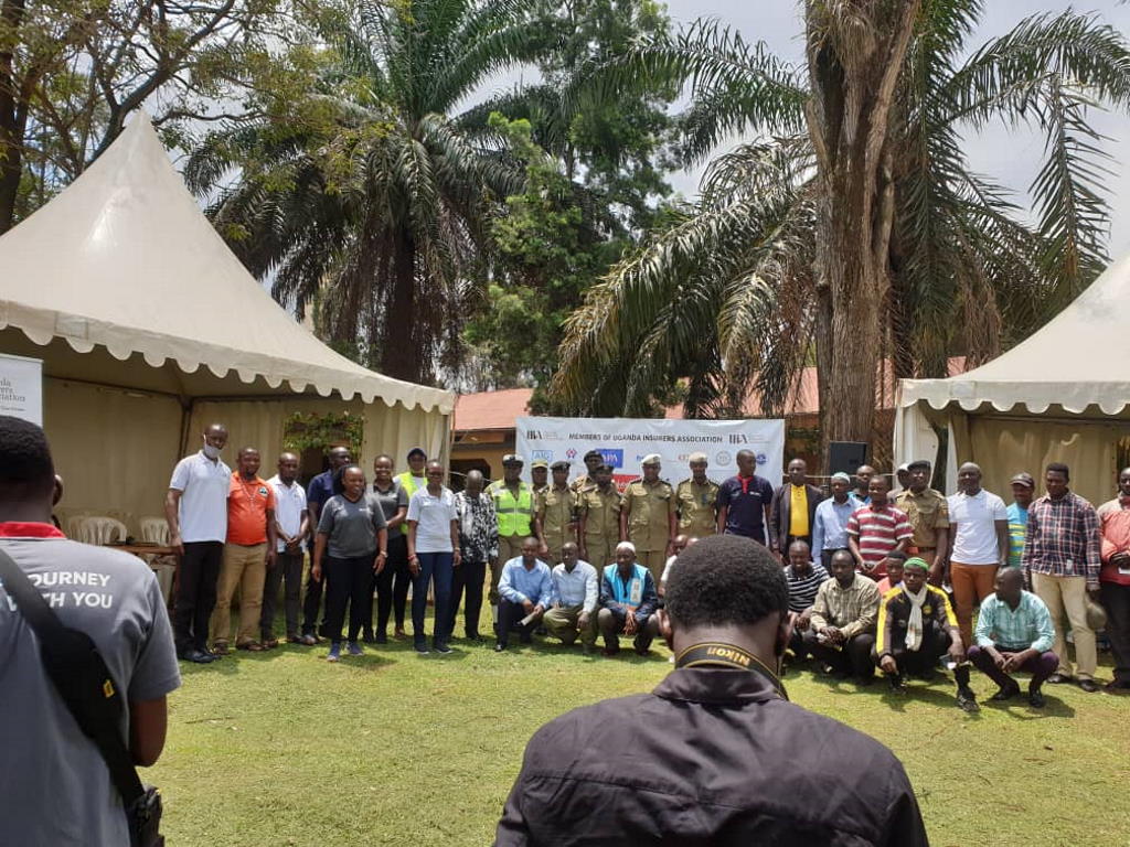A group picture of participants at a community engagement event in Kampala, Uganda